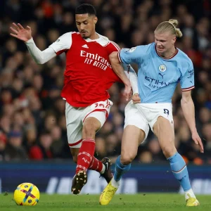 Wlliam Saliba of Arsenal battles for the ball with Erling Haaland in a Premier League clash. Image Credit- Football London