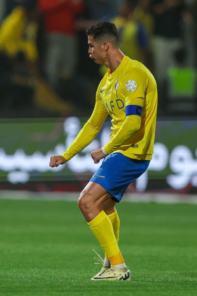 Ronaldo's obscene gesture to 'Messi' chants by fans. Credit: Imago