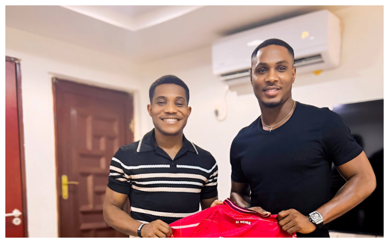 Odion Ighalo signs Pastor Jerry Eze || X